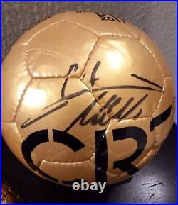 Cristiano Ronaldo Autographed Golden Ball and a Golden Boot Statue Cristiano Ronaldo Autographed Golden Ball and a Golden Boot Statue